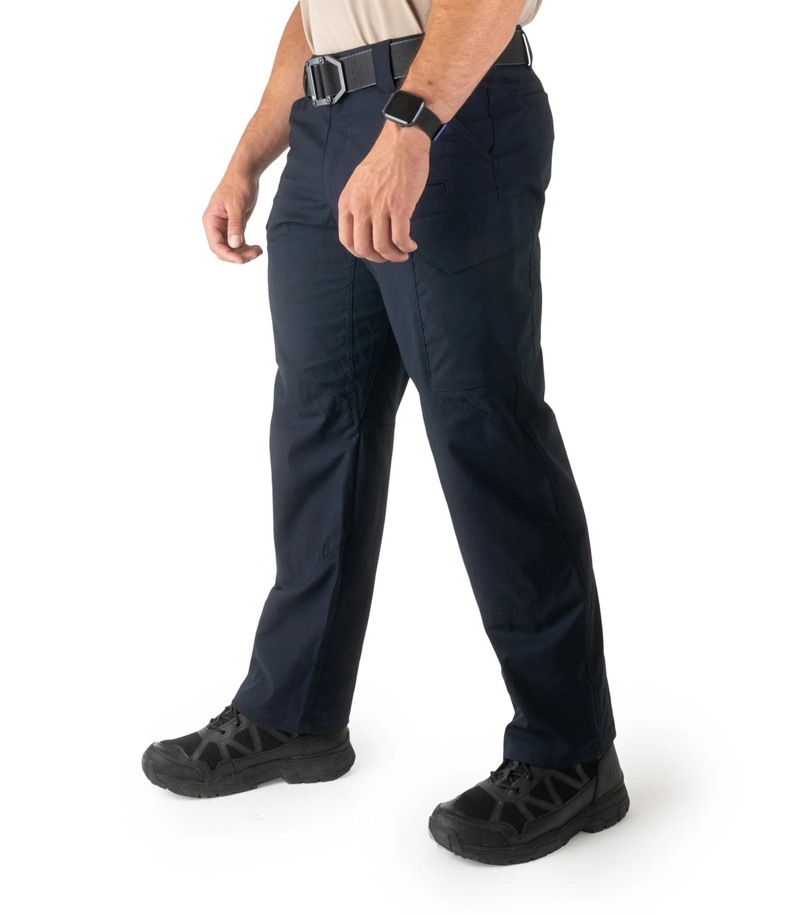 Person wearing navy pants on a white background