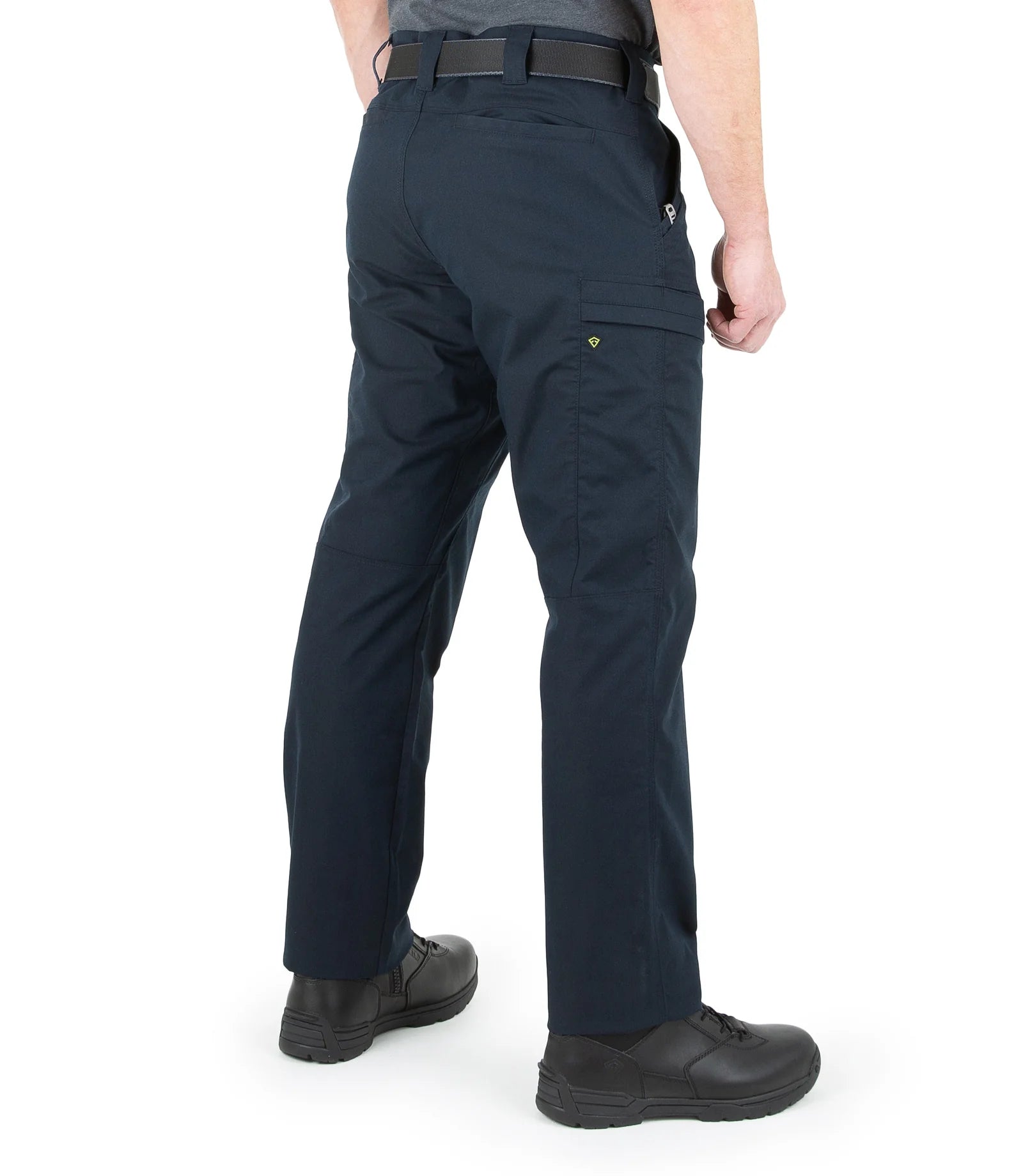 Person wearing navy blue pants on a white background