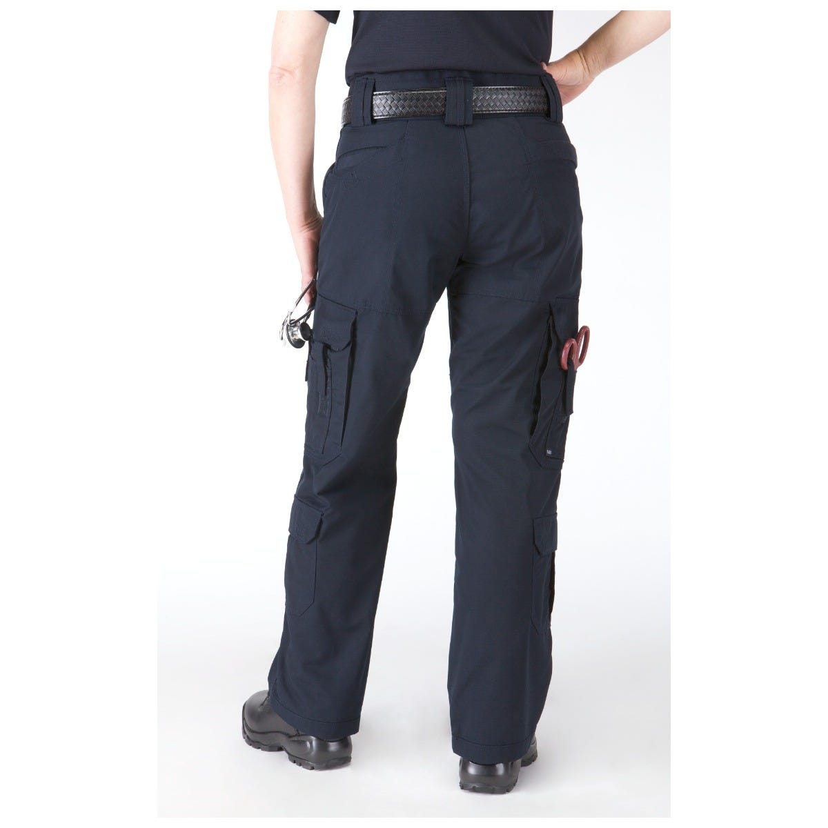 Navy blue cargo pants worn by a person on a white background