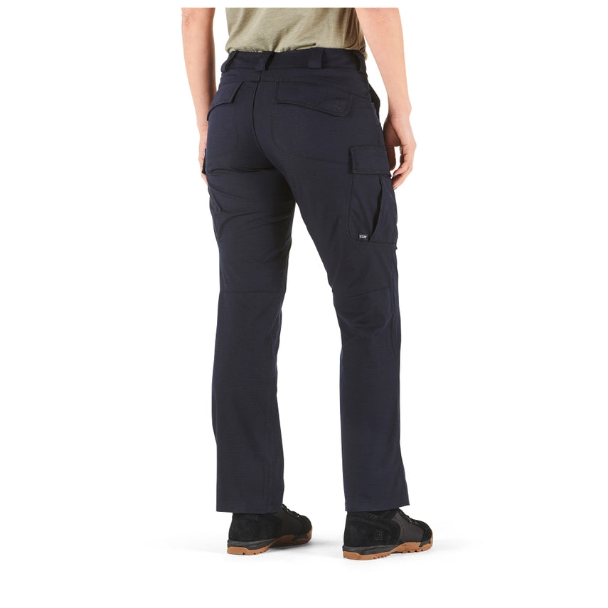 Person wearing navy blue tactical pants on a white background
