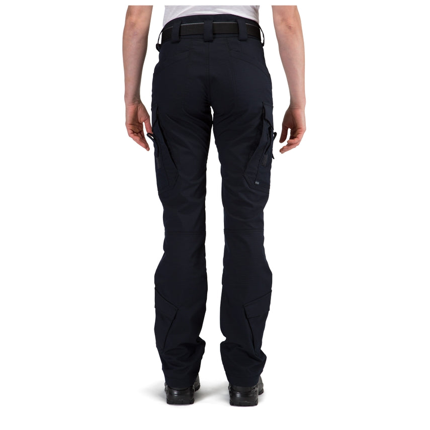 Black tactical pants worn by a person on a white background