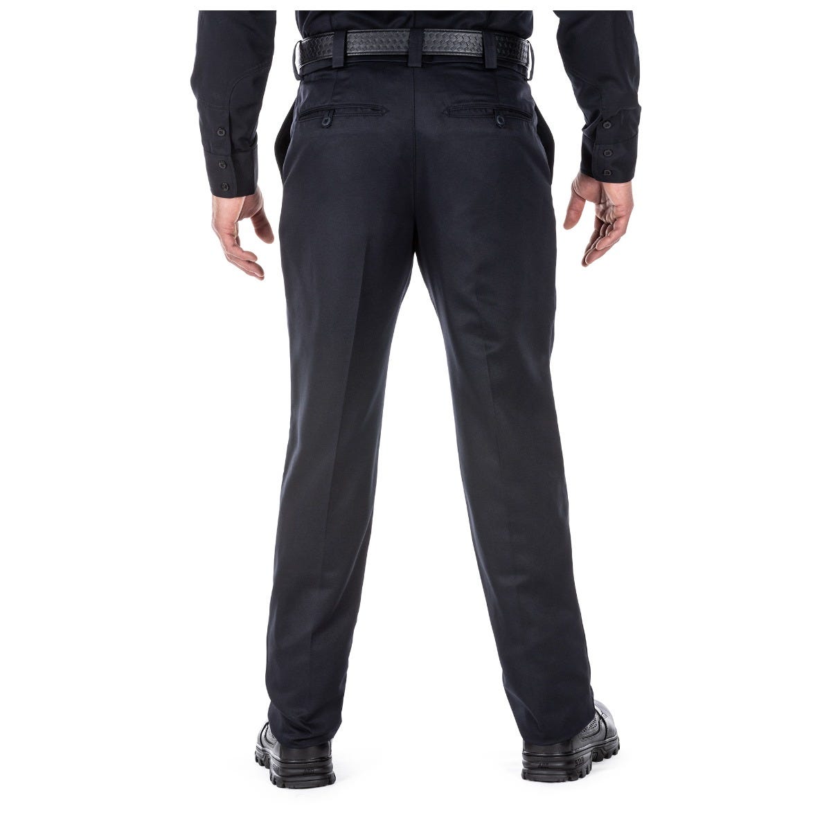 Black pants worn by a person on a white background