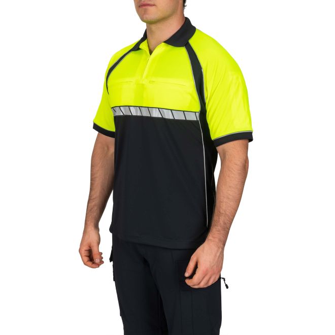 Person wearing a high-visibility shirt with black and yellow design on a white background