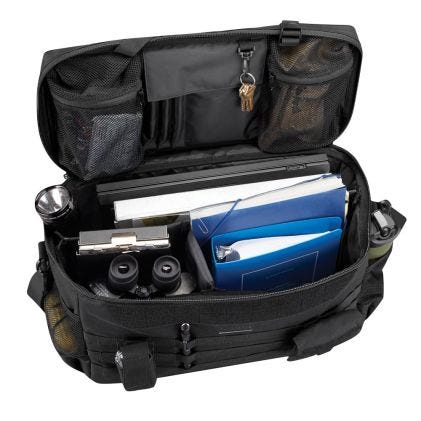 Black tactical bag with compartments containing a blue folder, flashlight, and other items on a white background