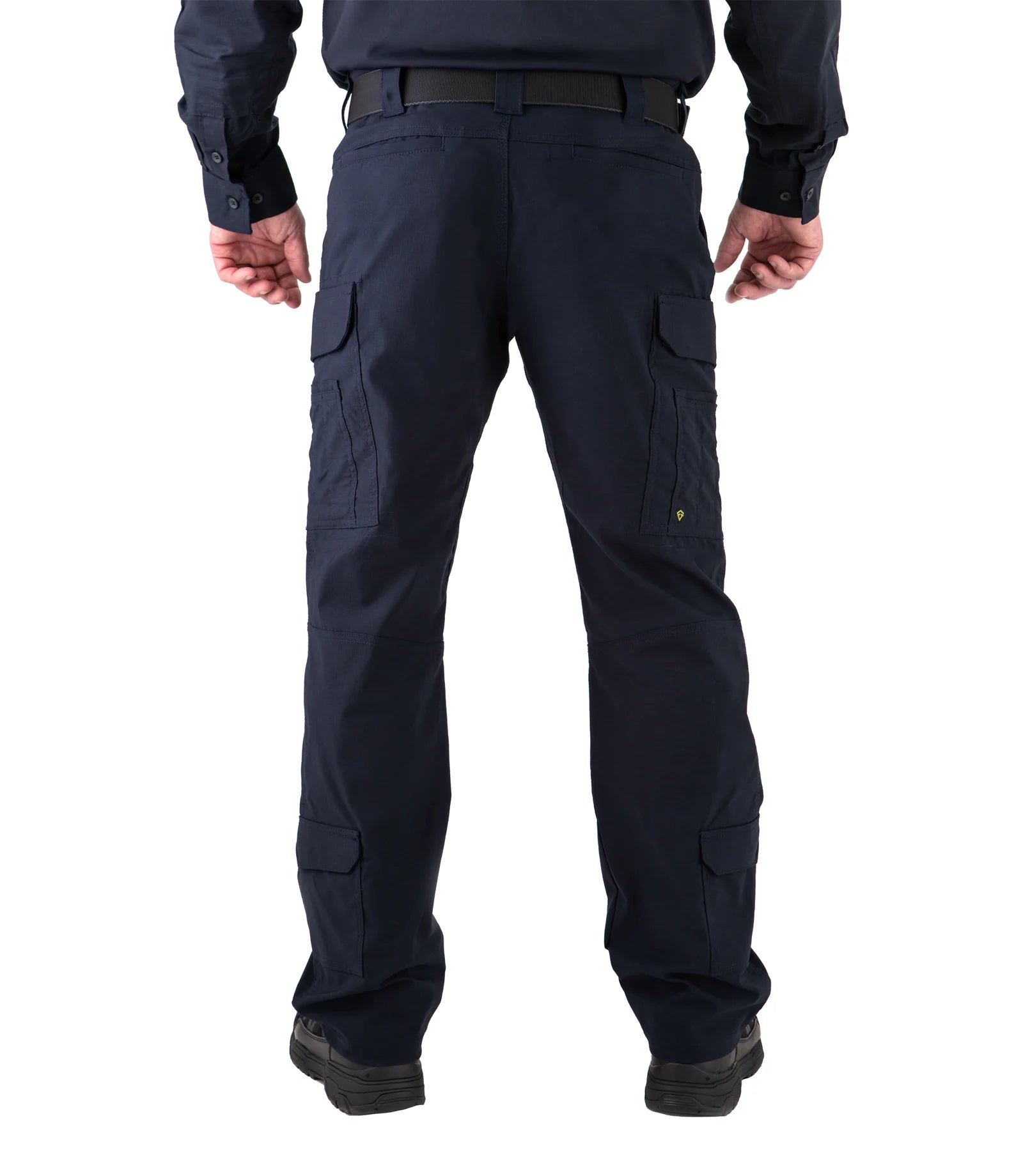 Dark blue cargo pants worn by a person on a white background