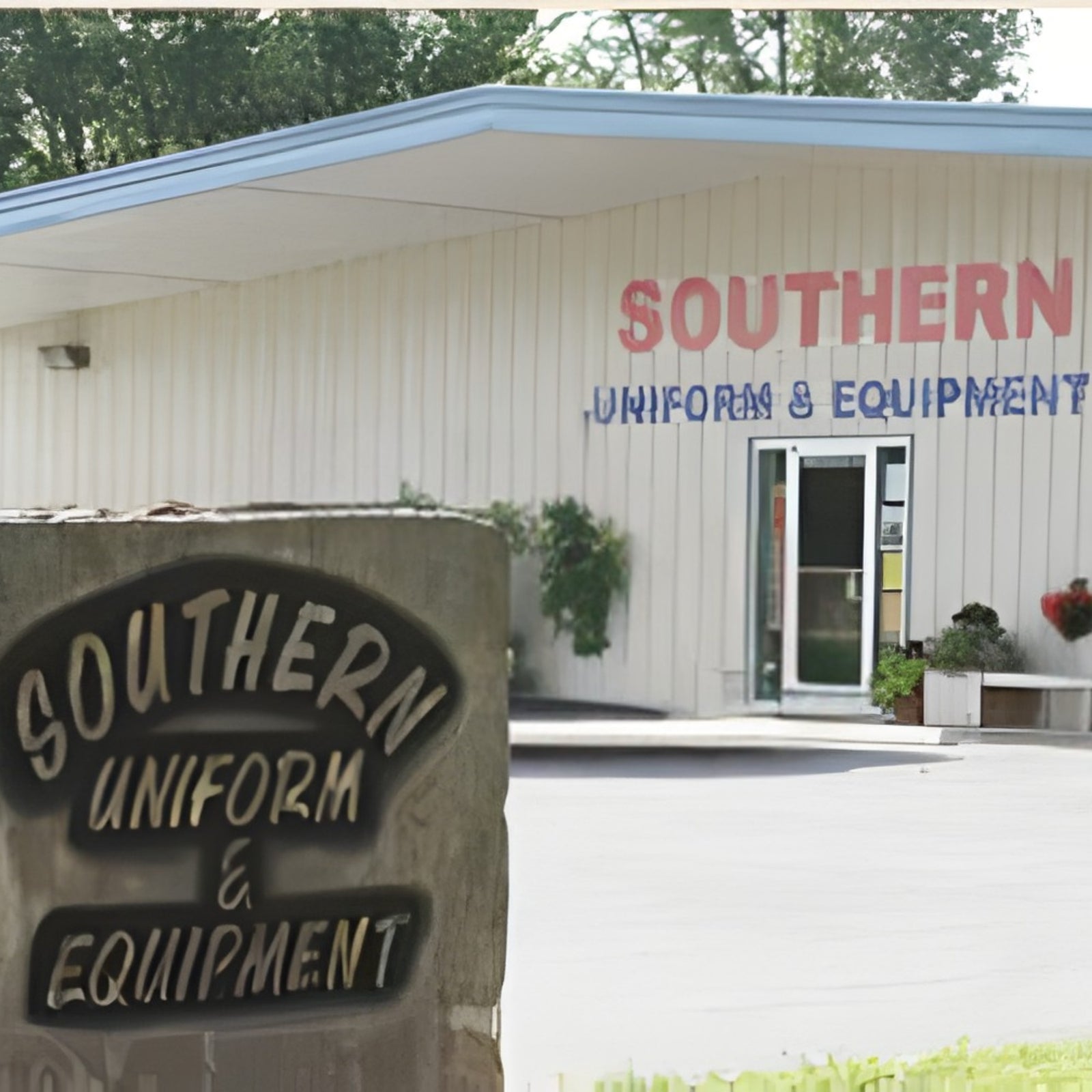 Building with 'Southern Uniform & Equipment' sign and a stone plaque in front.