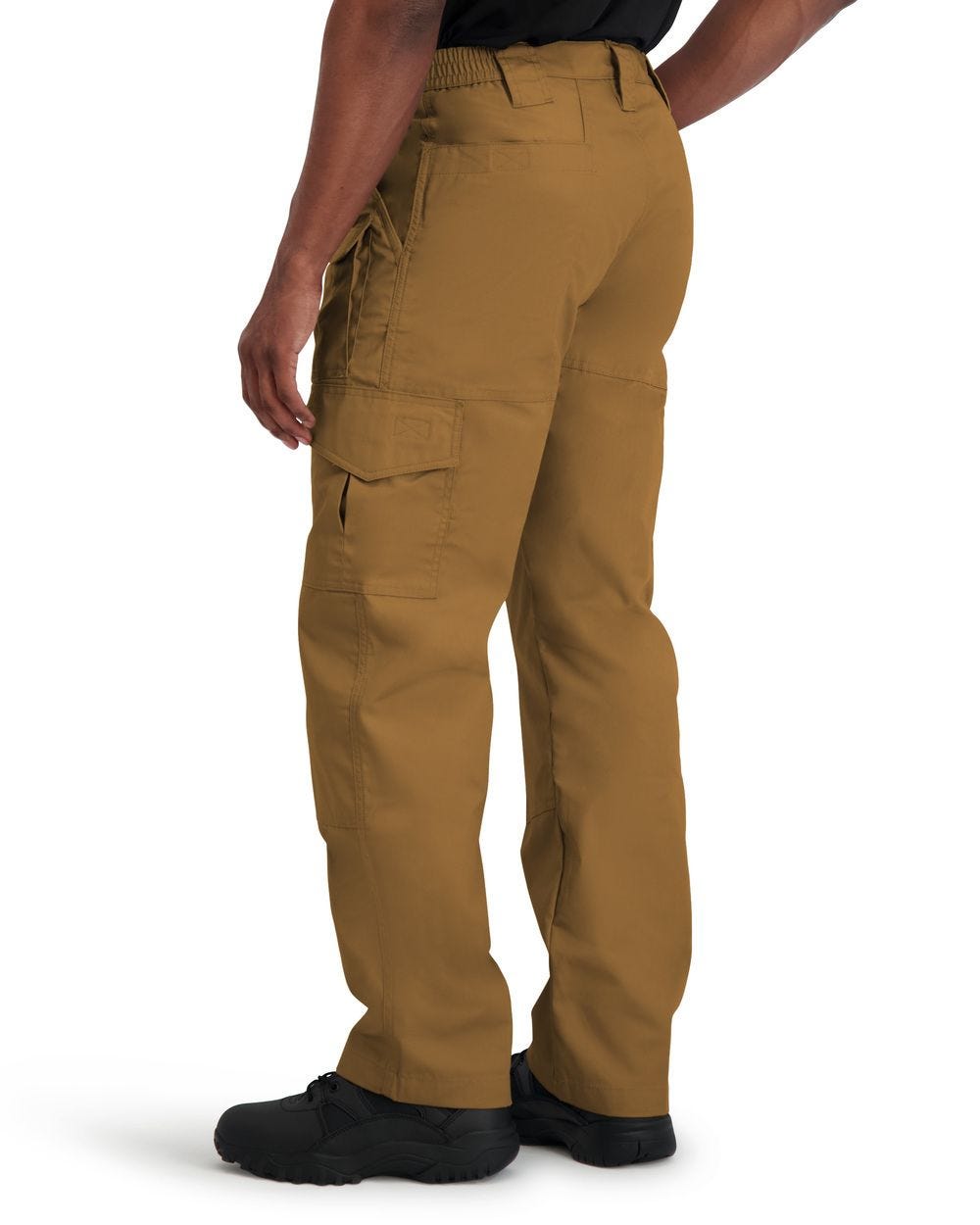 Brown tactical pants worn by a person on a white background