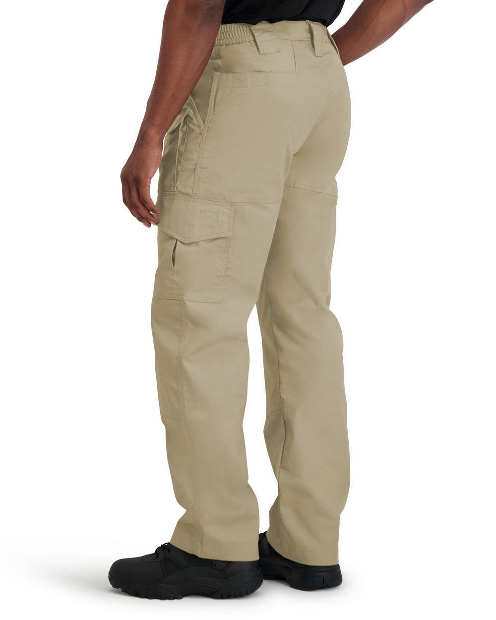 Beige cargo pants worn by a person on a white background