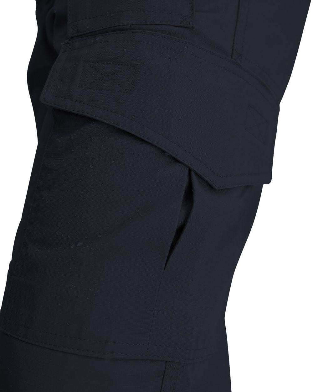 Close-up of dark blue pants with a pocket on a white background