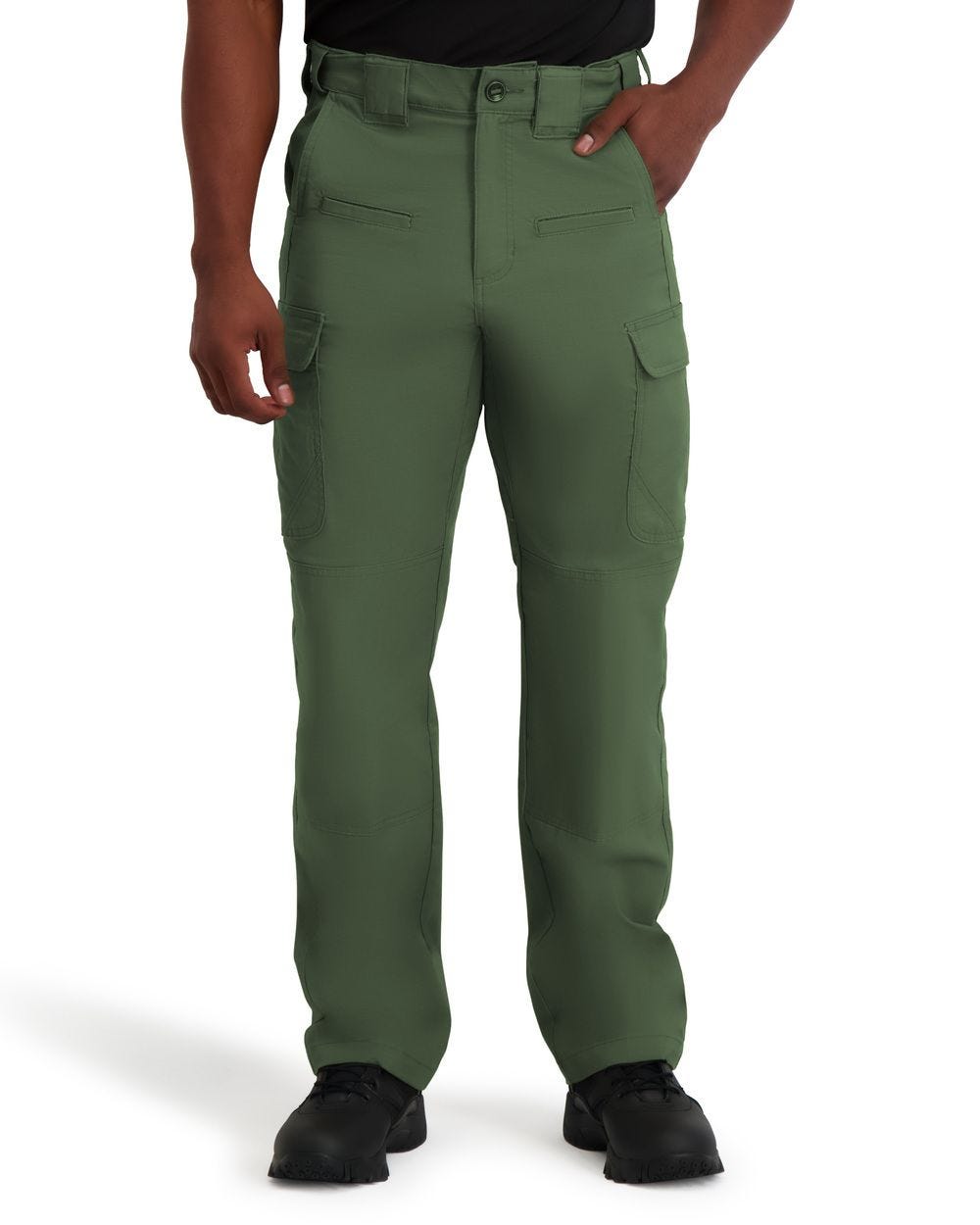 Green pants worn by a person on a white background