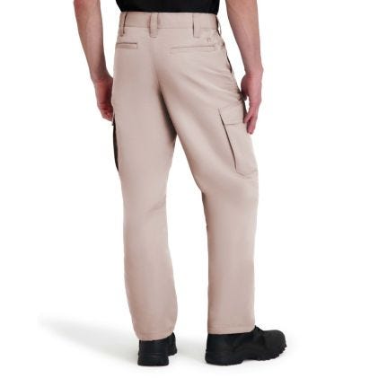 Beige pants worn by a person on a white background