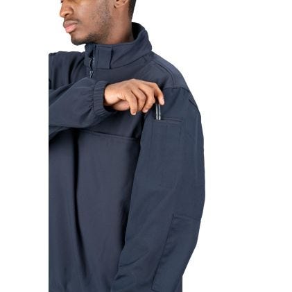 Person wearing a navy blue jacket on a white background