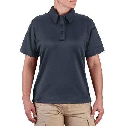Person wearing a navy blue polo shirt on a white background