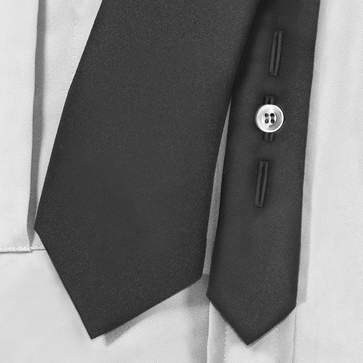 Black tie with a button on a light gray background