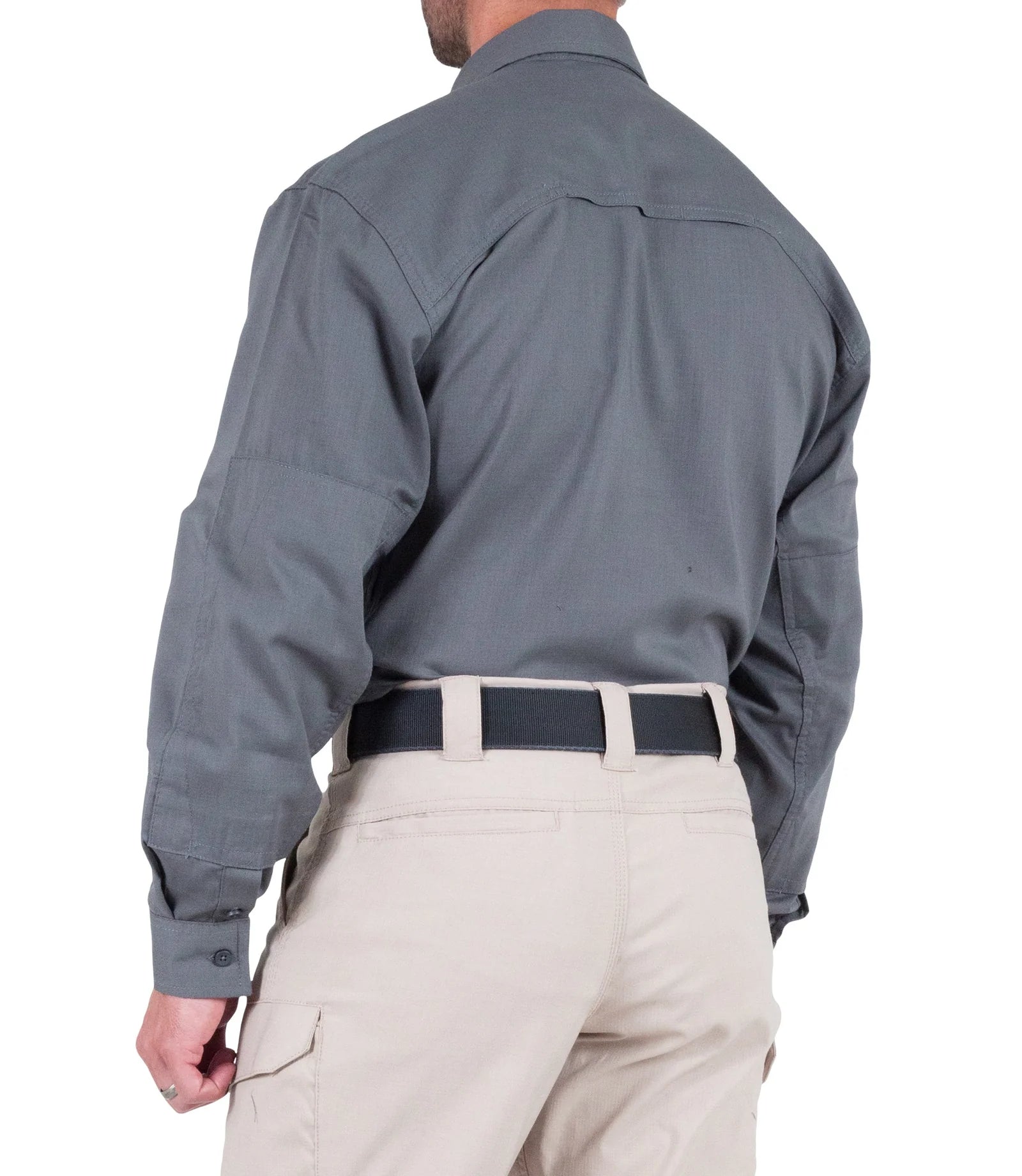 Person wearing a gray shirt and beige pants on a white background