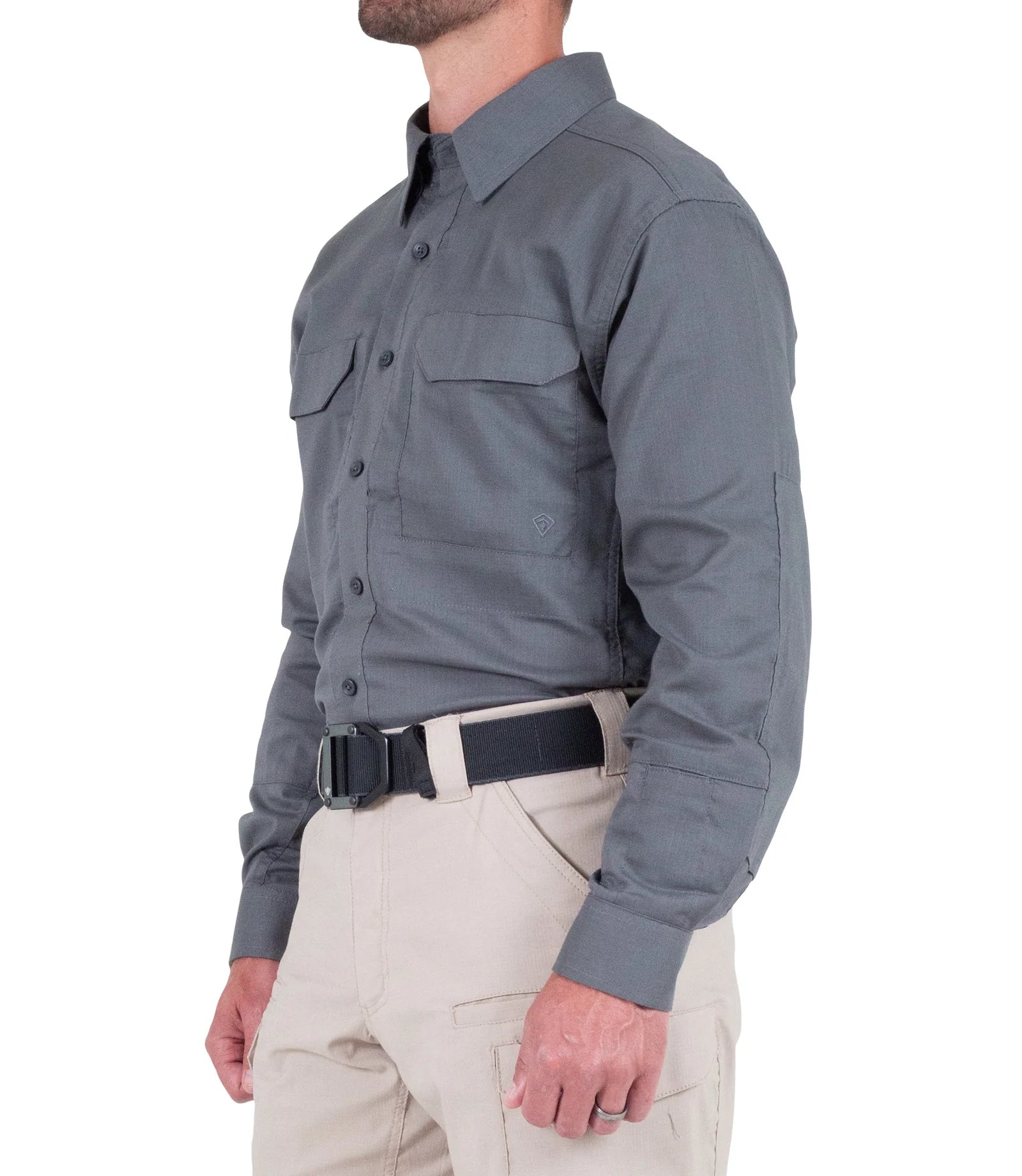 Person wearing a gray long-sleeve shirt and beige pants on a white background