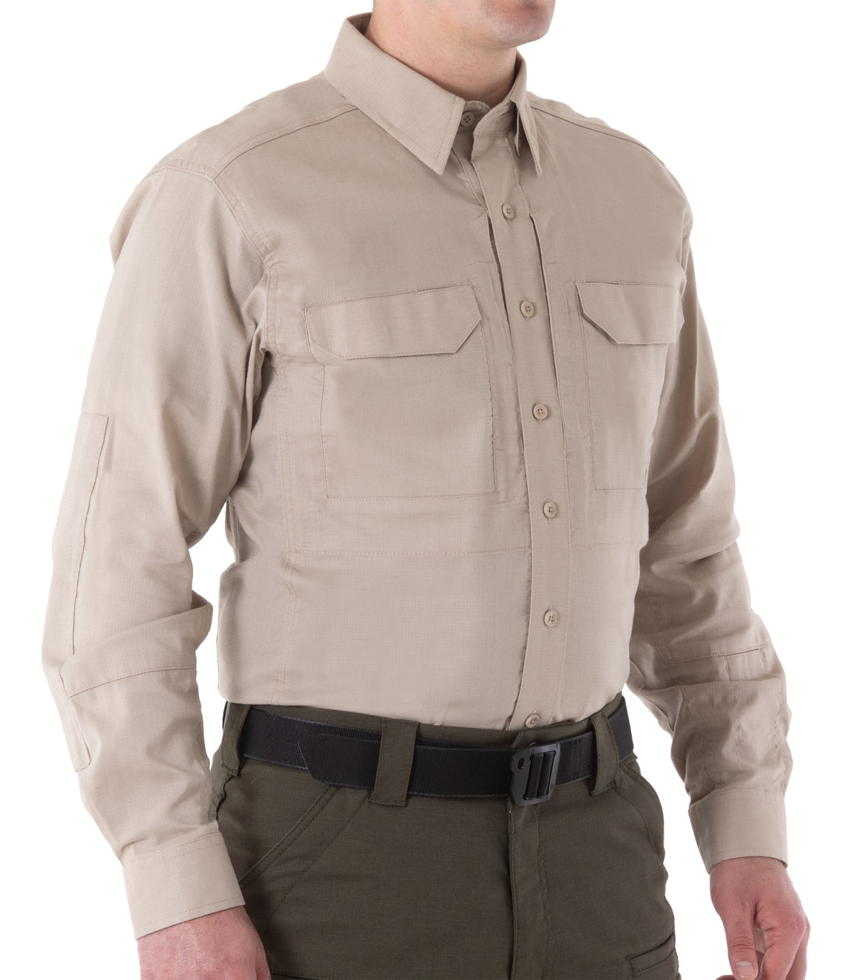Beige long-sleeve shirt worn by a person on a white background