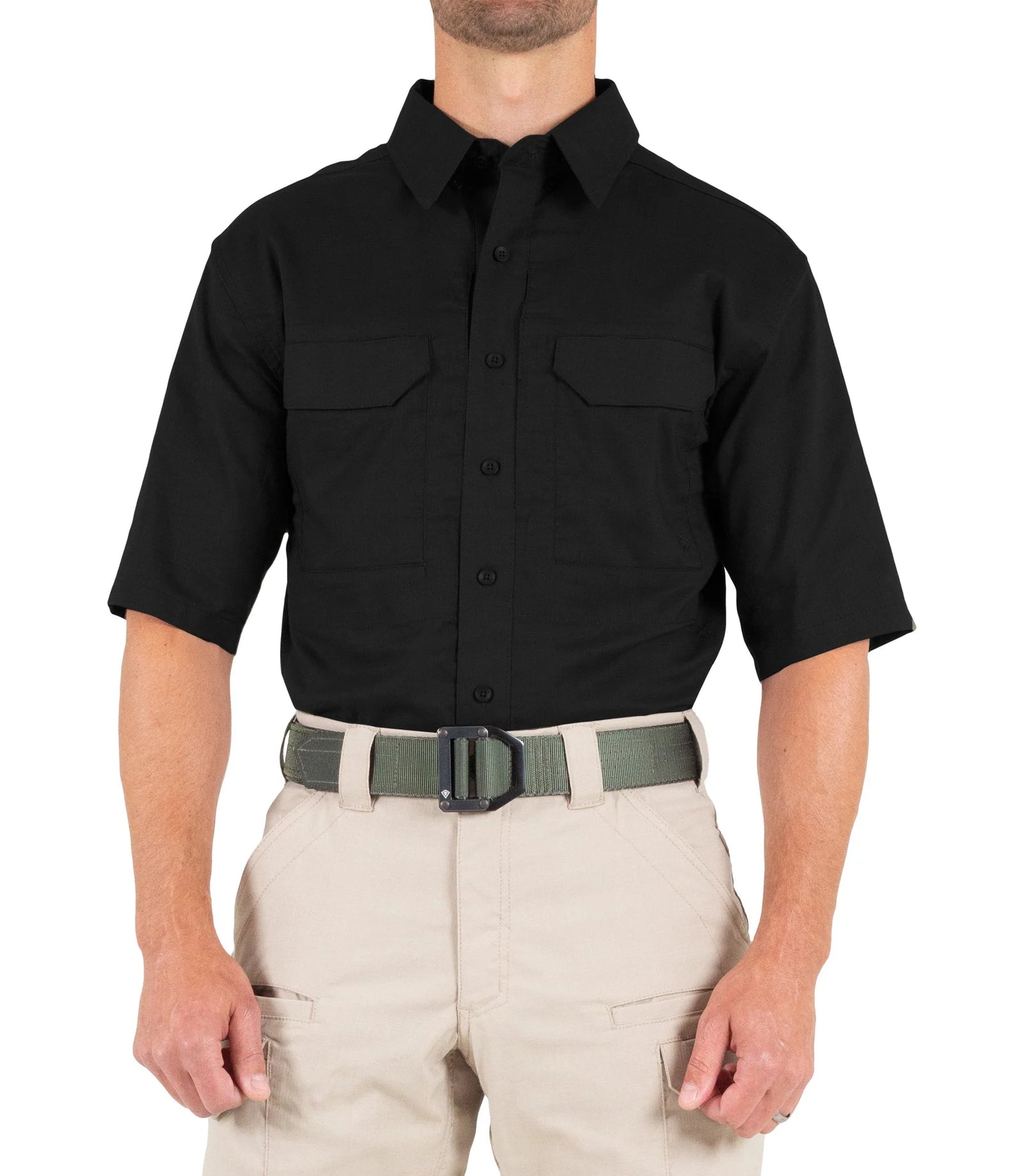 Person wearing a black short-sleeve shirt and beige pants on a white background