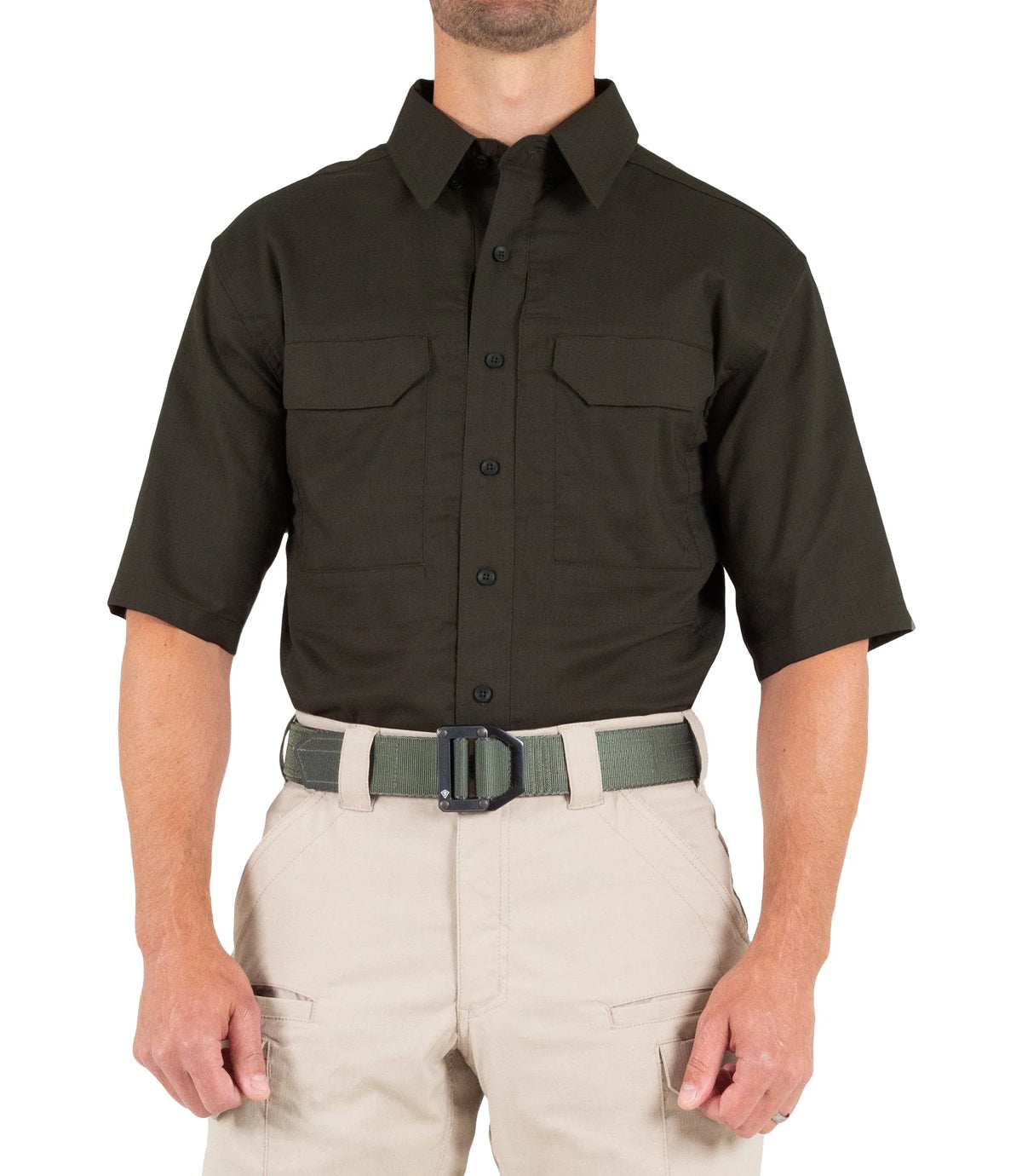 Person wearing a black short-sleeve shirt and beige pants on a white background