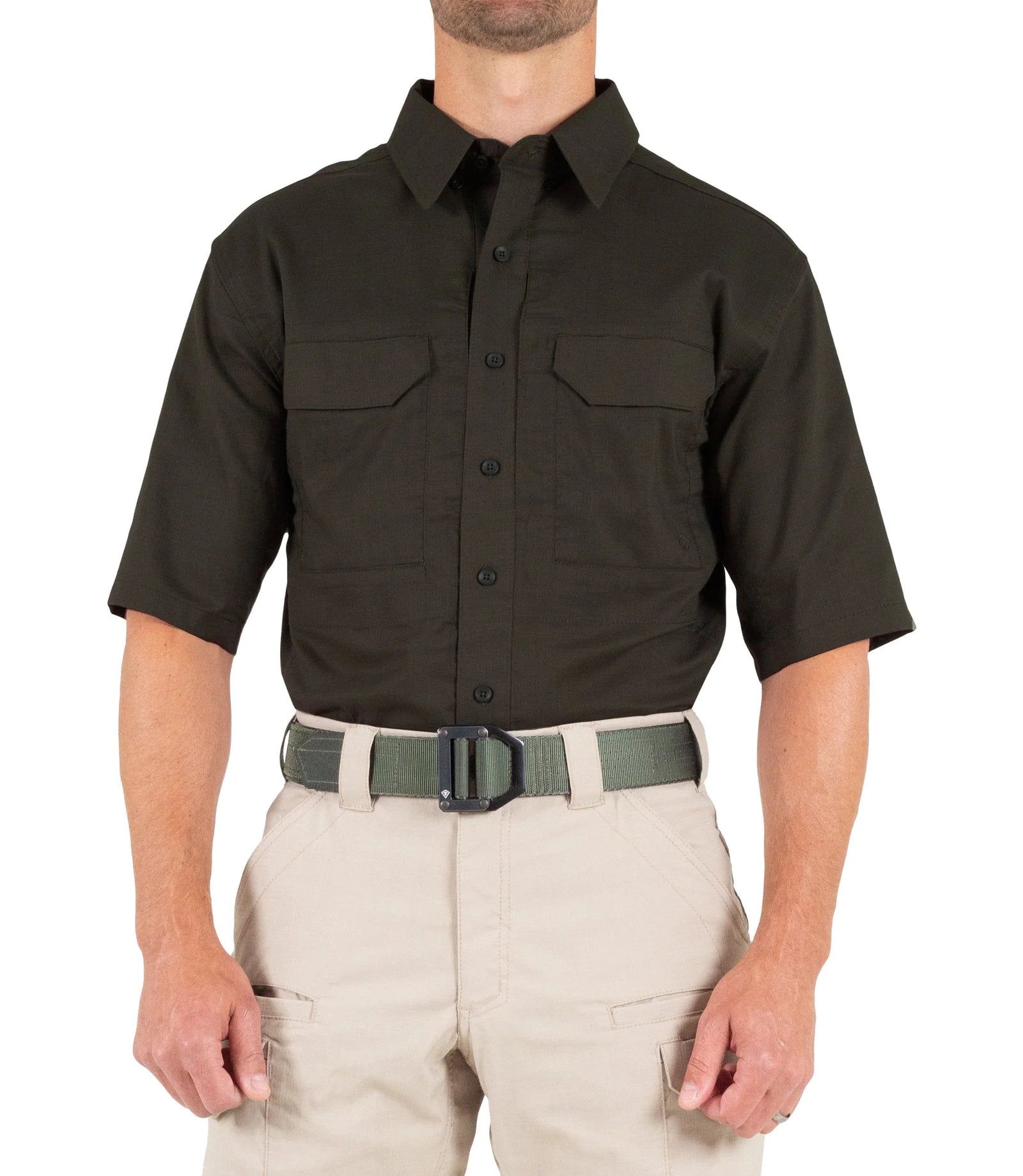 Person wearing a black short-sleeve shirt and beige pants on a white background