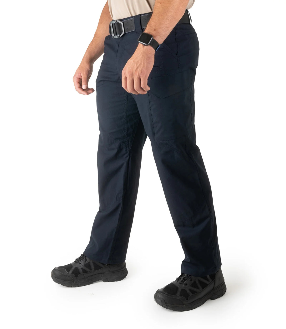 Person wearing navy pants on a white background