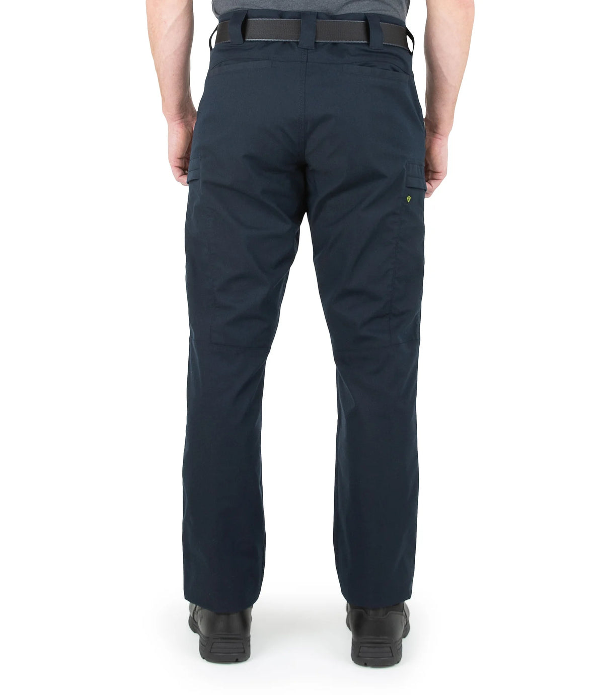 Navy blue pants worn by a person on a white background