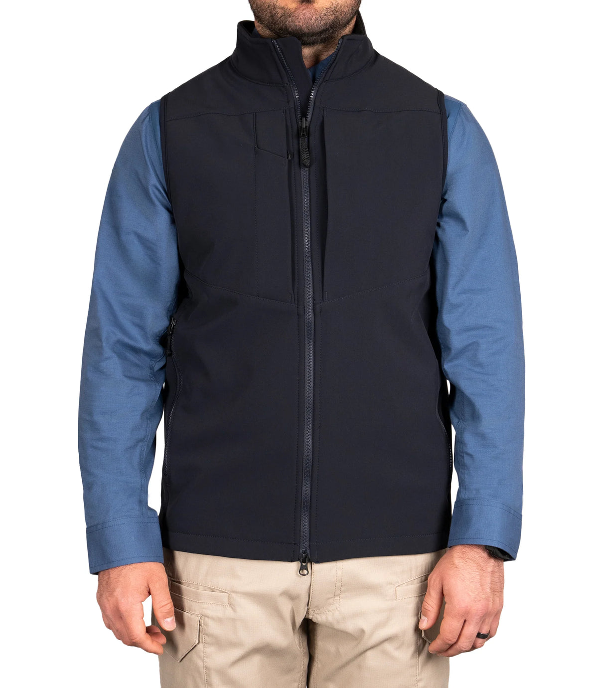 Man wearing a black vest with blue sleeves on a white background