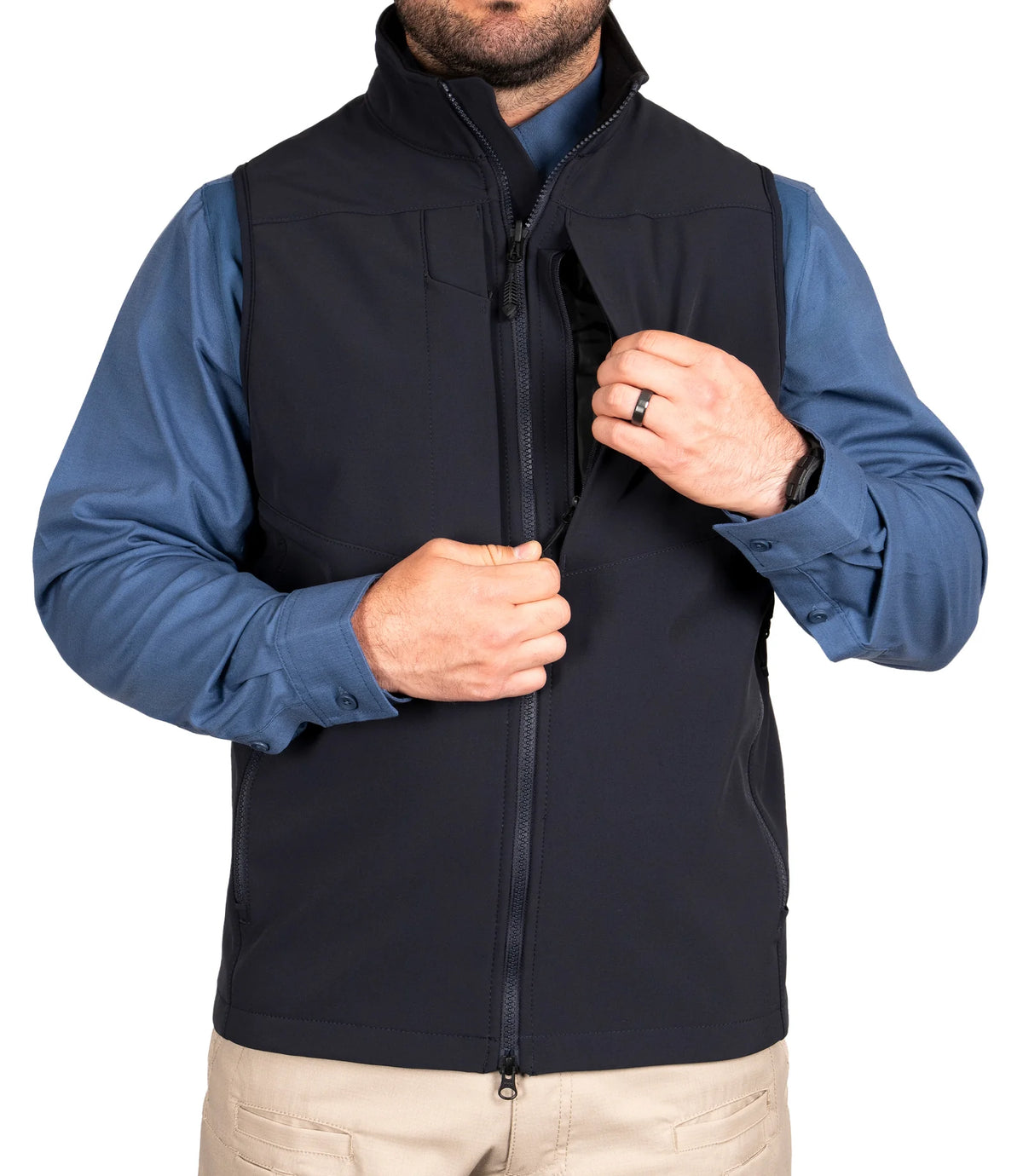 Person wearing a black and blue jacket on a white background