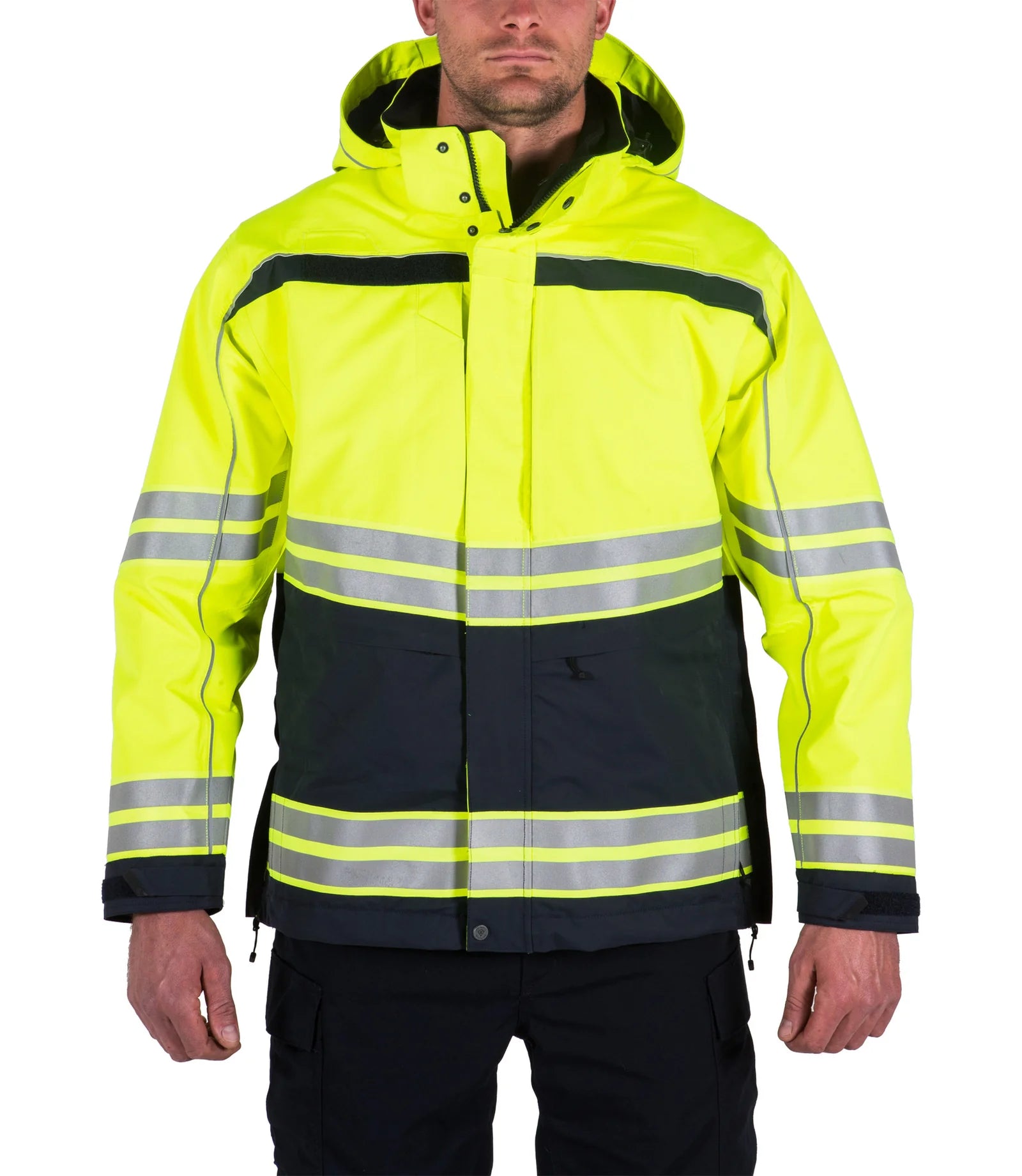Person wearing a high-visibility yellow and black jacket with reflective stripes on a white background
