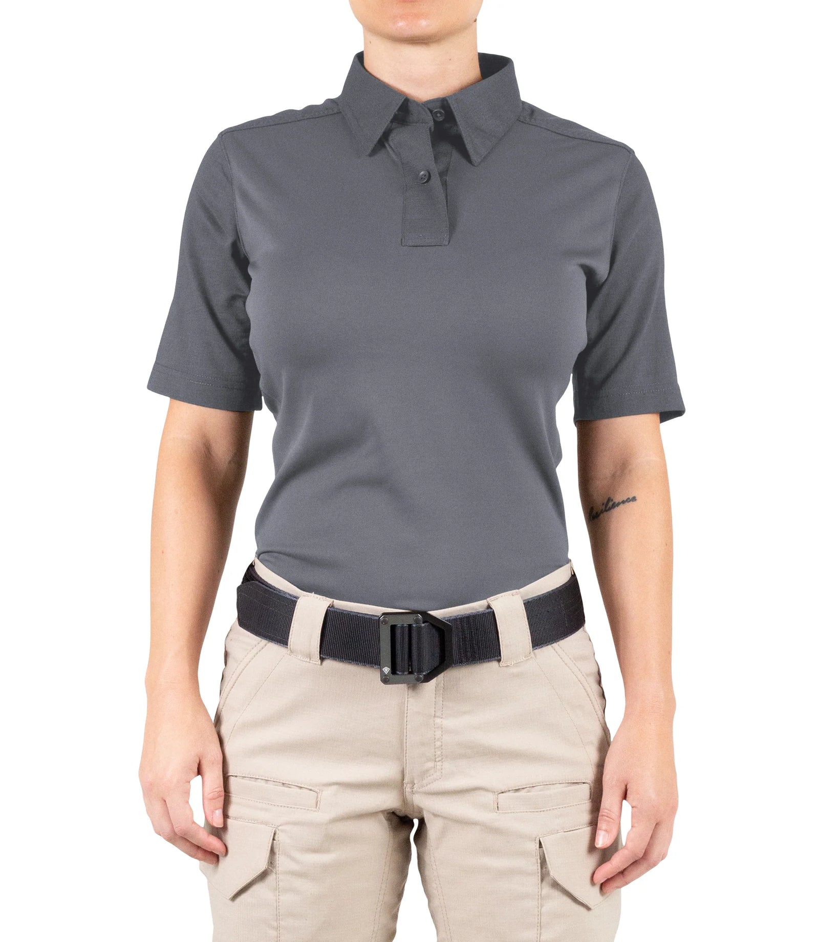 Person wearing a gray polo shirt and beige pants on a white background