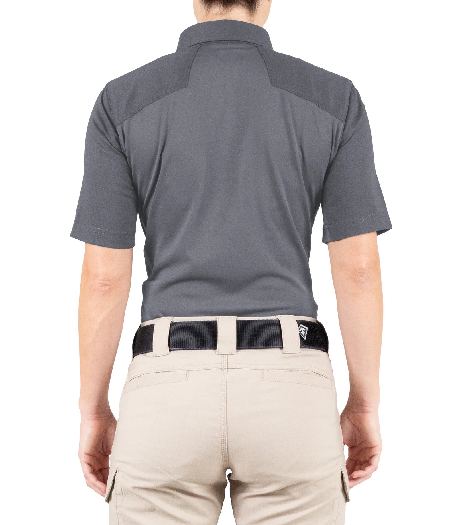Person wearing a gray polo shirt and beige pants on a white background