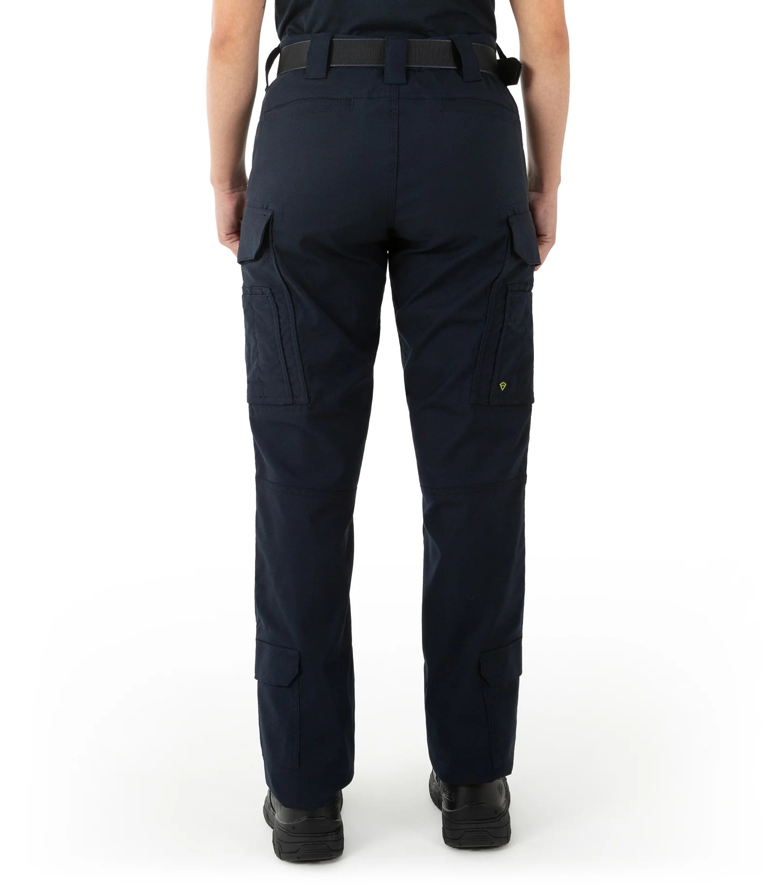 Navy blue tactical pants worn by a person on a white background