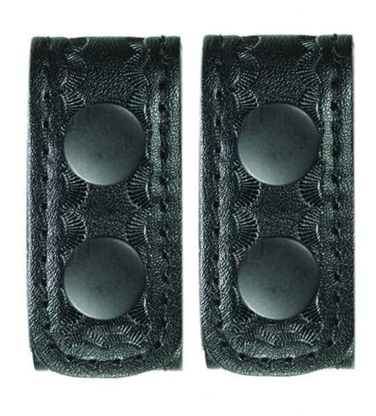 Two black leather straps with textured surface on a white background