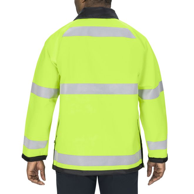Person wearing a bright yellow safety jacket with reflective stripes on a white background