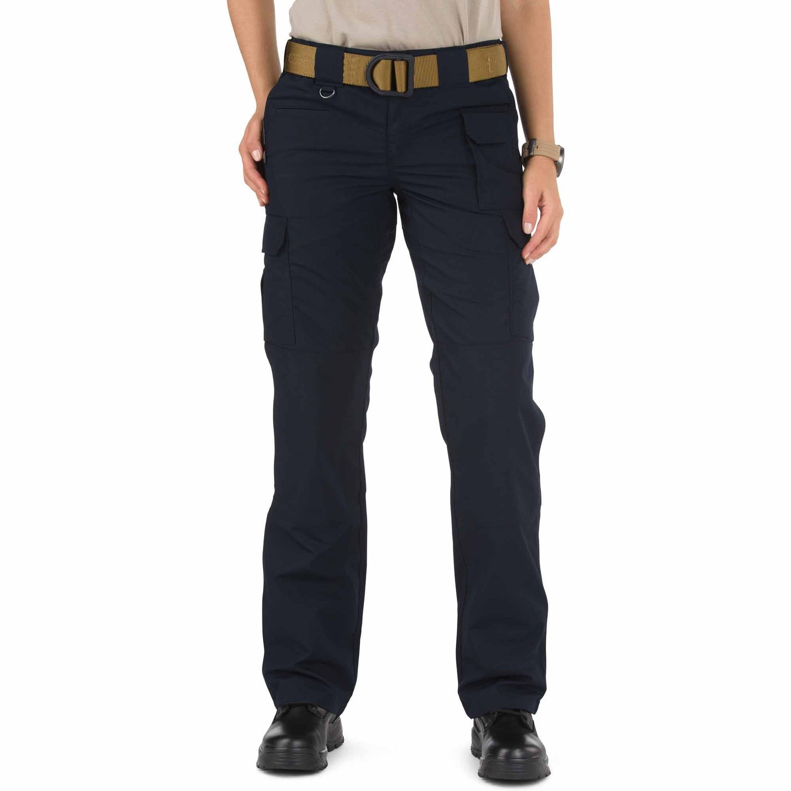Person wearing navy blue pants with a brown belt on a white background