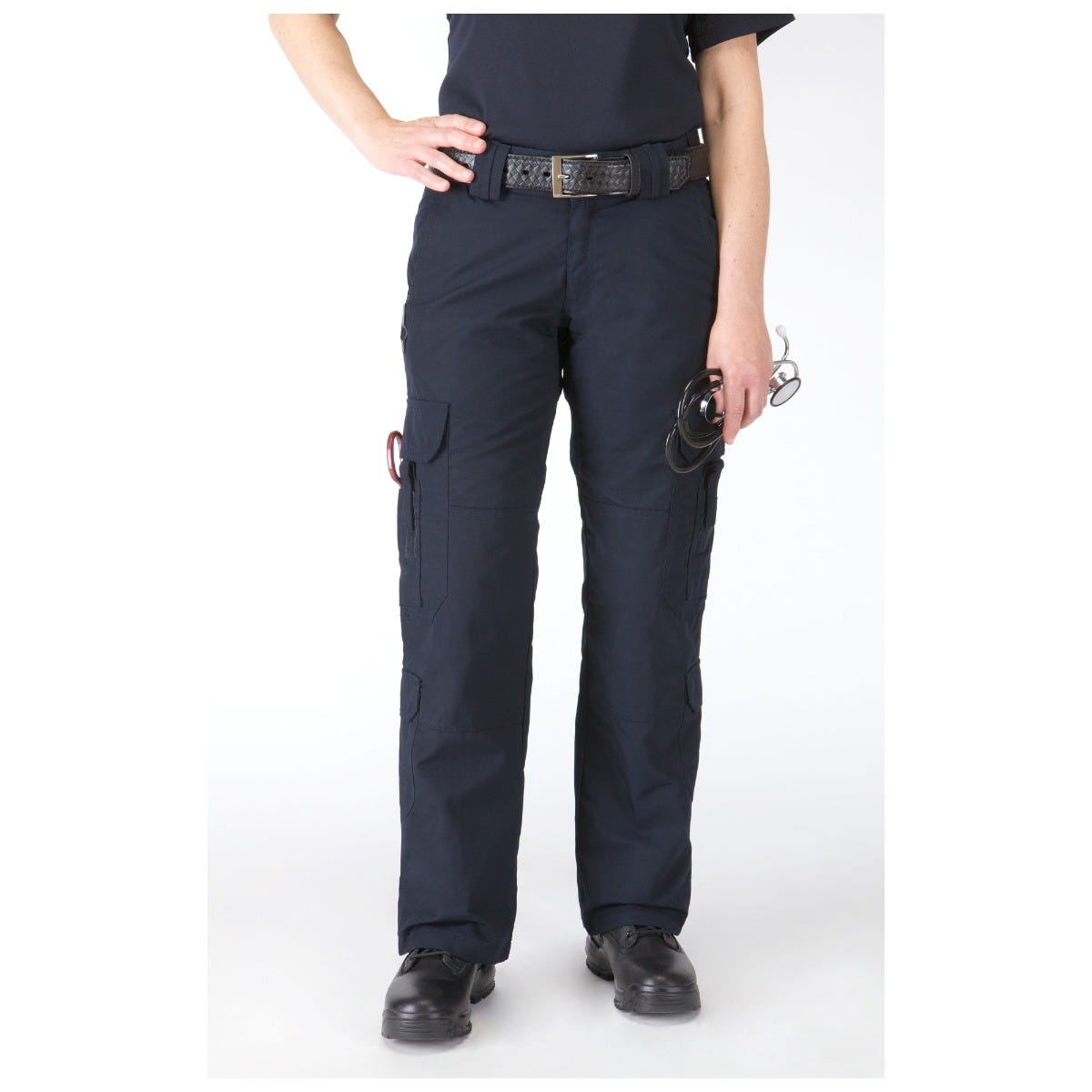 Person wearing navy blue cargo pants on a white background
