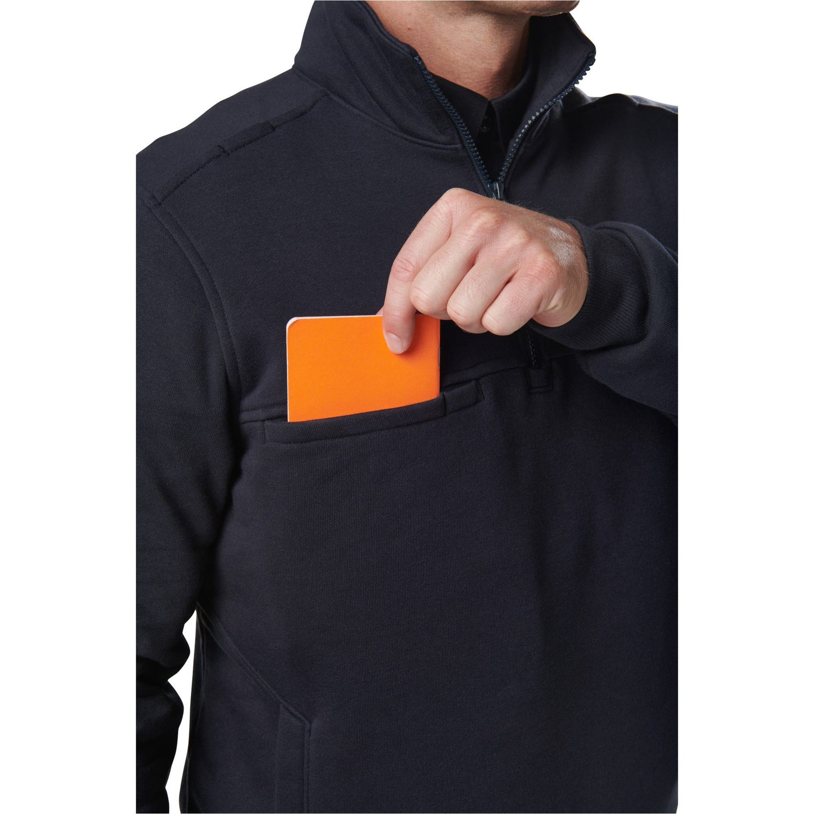 Person wearing a dark jacket with an orange card in a pocket on a white background