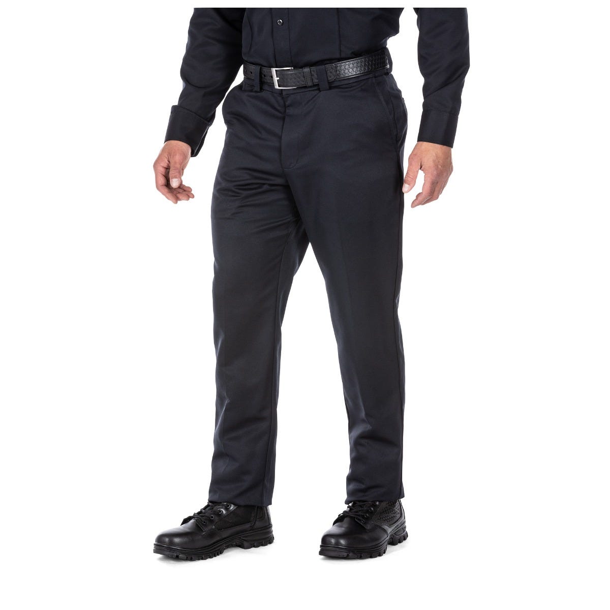 Person wearing black pants and black shoes on a white background