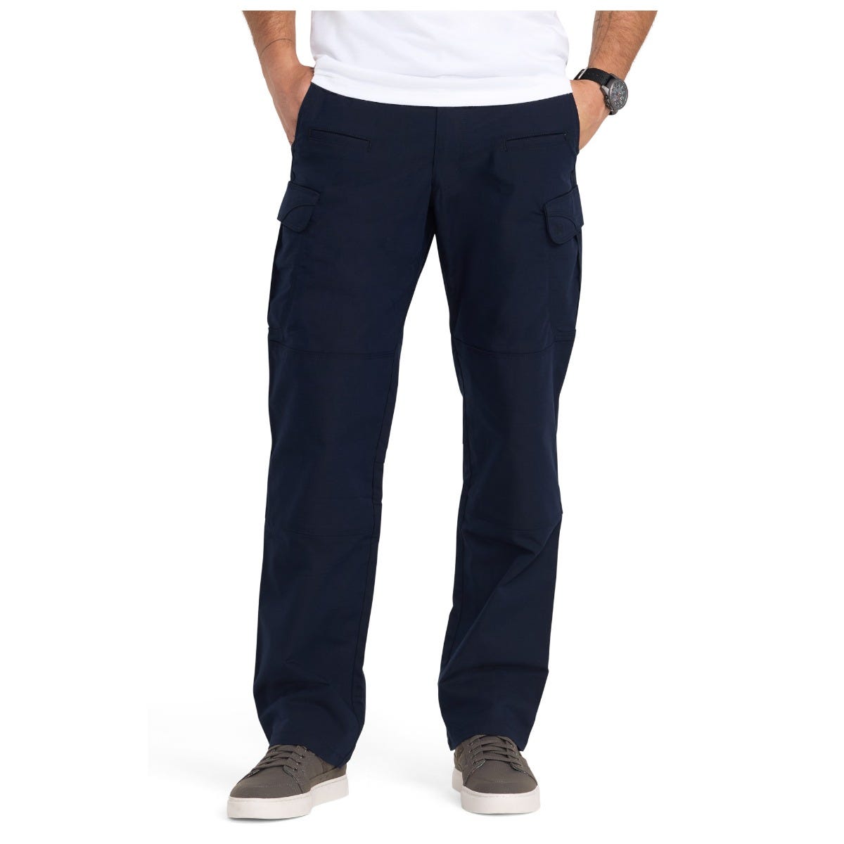 Person wearing navy cargo pants on a white background