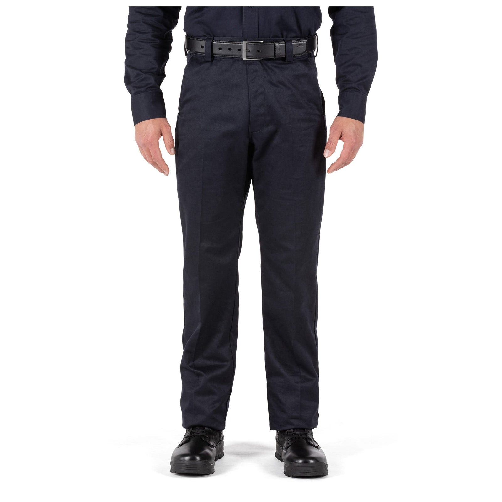 Person wearing navy blue pants with a belt on a white background
