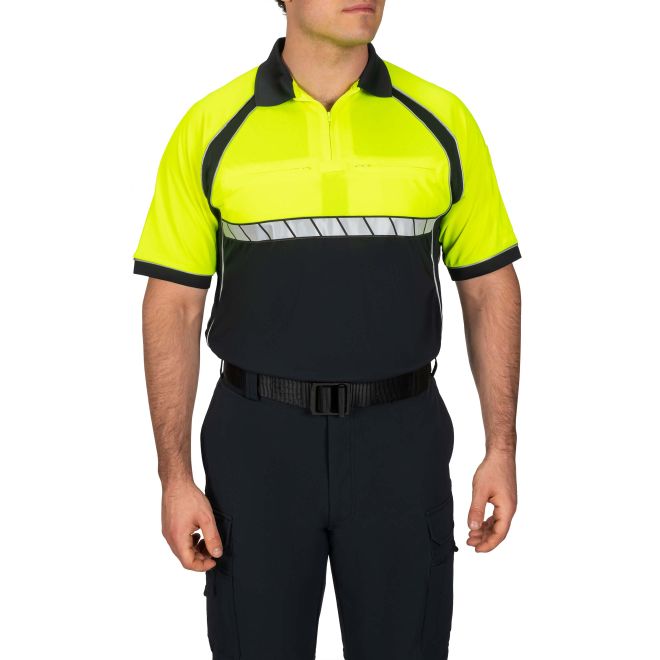 Person wearing a high-visibility yellow and black safety shirt on a white background