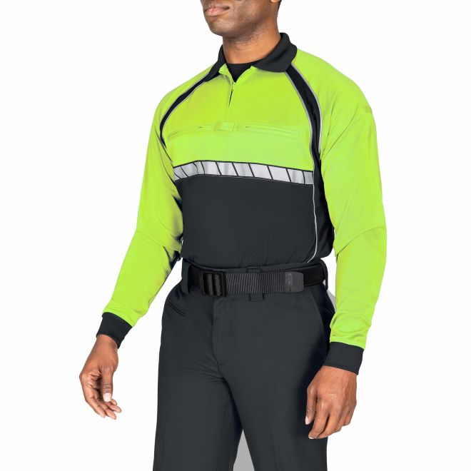 Person wearing a bright green and black safety jacket on a white background