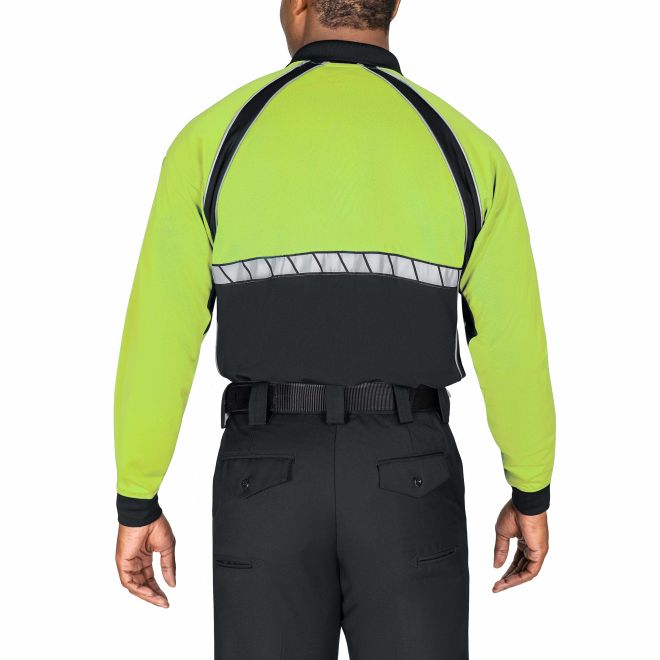 Person wearing a high-visibility safety jacket with reflective stripes on a white background