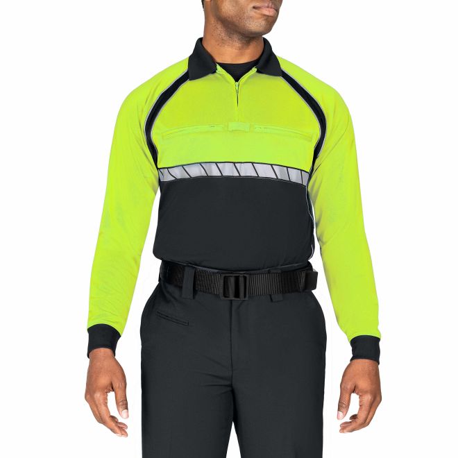 Person wearing a bright yellow and black sports referee uniform on a white background