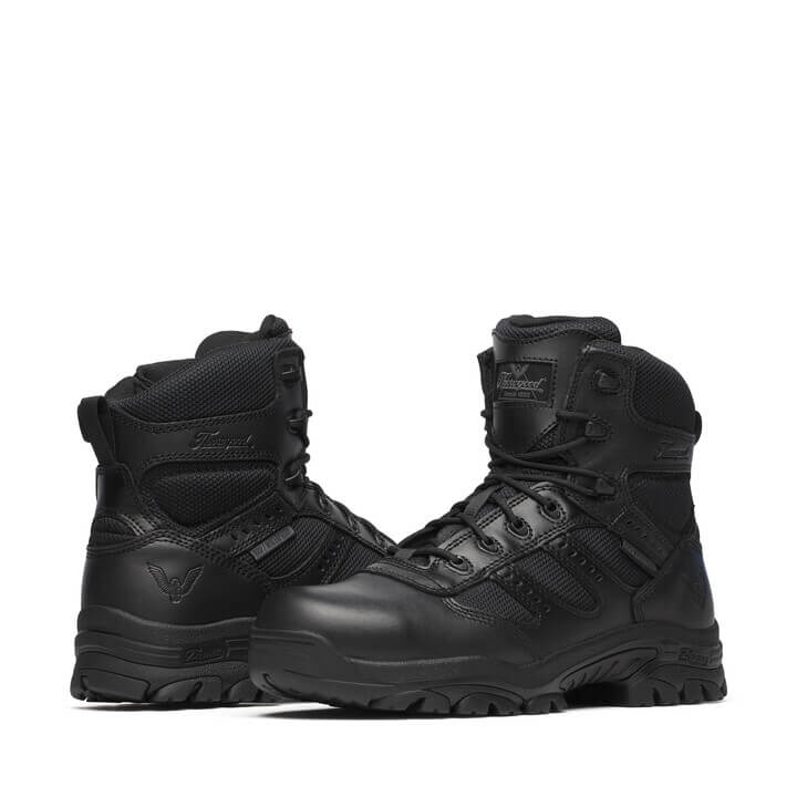 Pair of black tactical boots on a white background