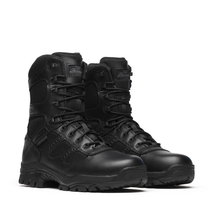 Pair of black tactical boots on a white background