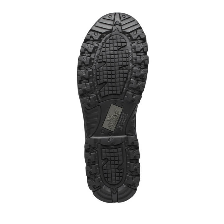 Close-up of a black boot sole with tread pattern on a white background