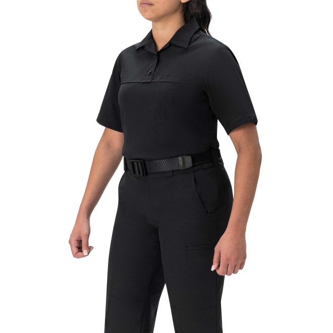 Person wearing a black short-sleeve uniform with a belt on a white background