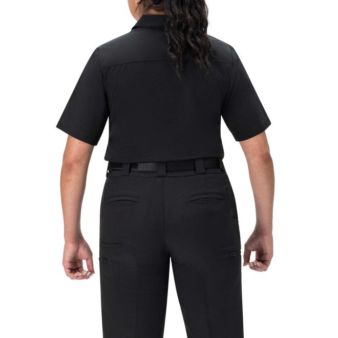 Person wearing a black short-sleeve shirt and pants on a white background