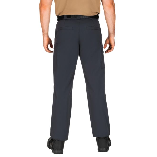 Person wearing dark gray cargo pants on a white background